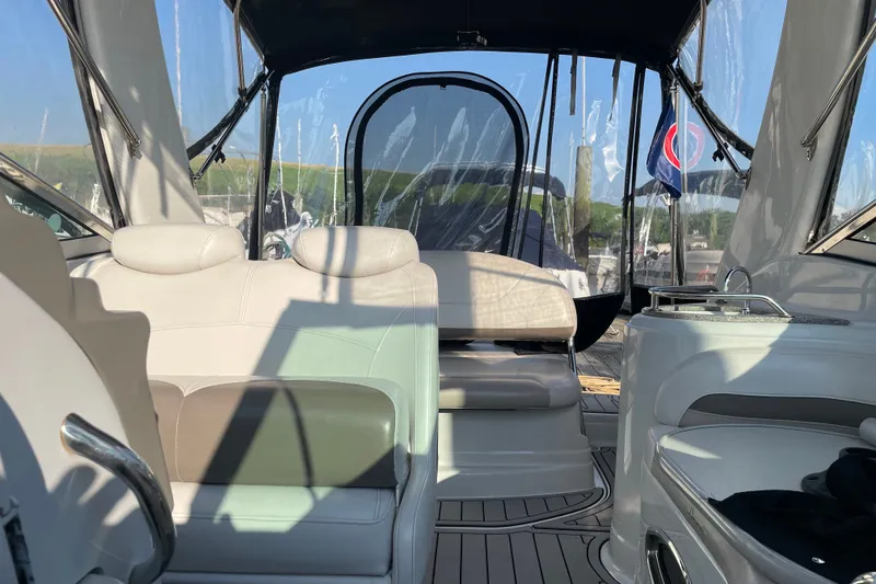 Slide: The Image of Interior view of a 2012 Crownline 260 CR boat with seating and canopy. - 6