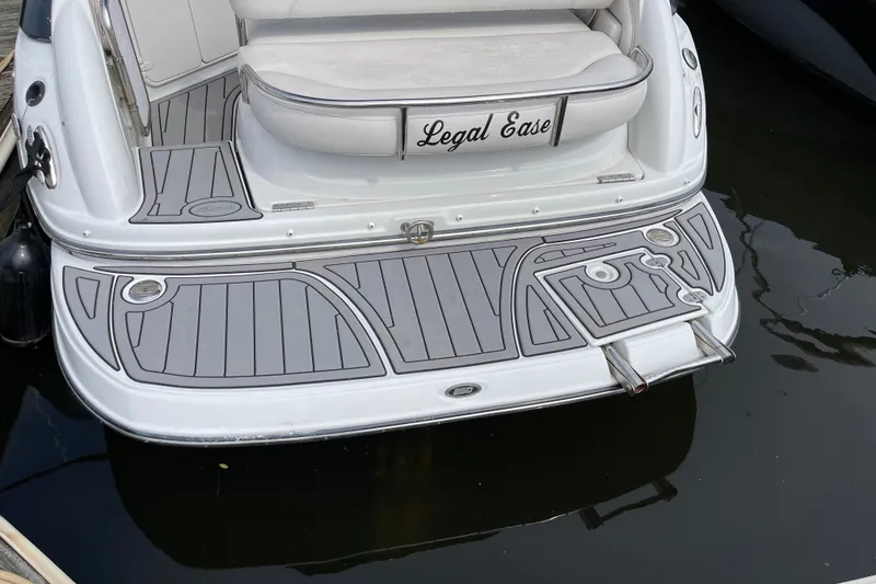 Slide: The Image of Crownline 260 CR 2012 boat stern with custom swim platform and "Legal Ease" nameplate. - 4