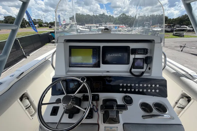 Slide: The Image of Control panel of a 2011 Jefferson Marlago FS35 boat with Garmin navigation system. - 34