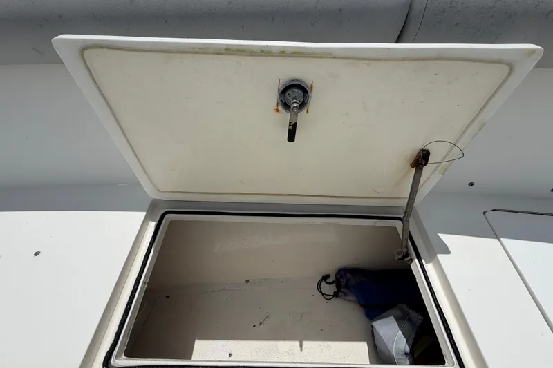 Slide: The Image of Open storage compartment on a 2011 Jefferson Marlago FS35 boat. - 65