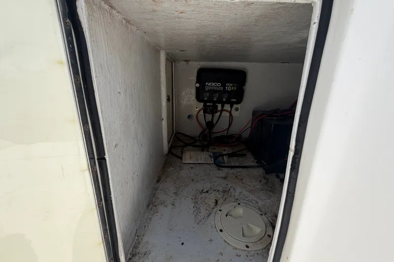 Slide: The Image of Interior compartment of a 2011 Jefferson Marlago FS35 with NOCO Genius battery charger. - 23