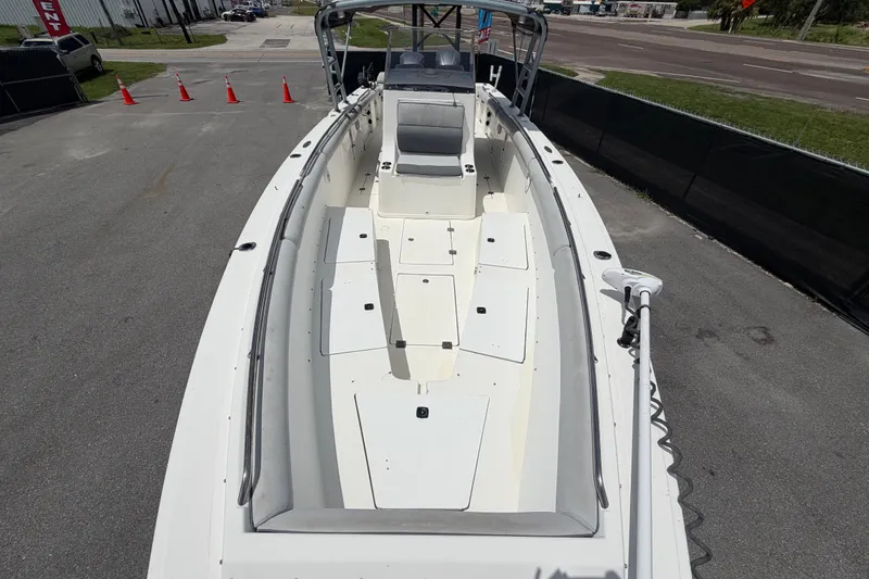 Slide: The Image of 2011 Jefferson Marlago FS35 boat with spacious deck and seating, parked on pavement. - 70