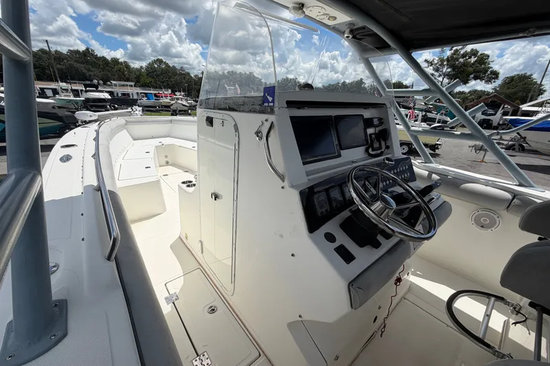 Slide: The Image of 2011 Jefferson Marlago FS35 boat cockpit with steering wheel and navigation controls. - 43