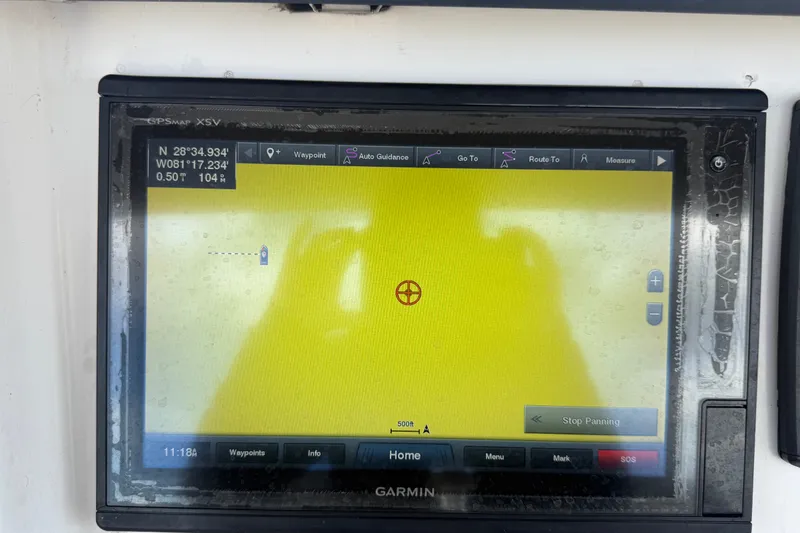 Slide: The Image of Garmin GPS display on 2011 Jefferson Marlago FS35 boat showing coordinates and navigation options. - 35