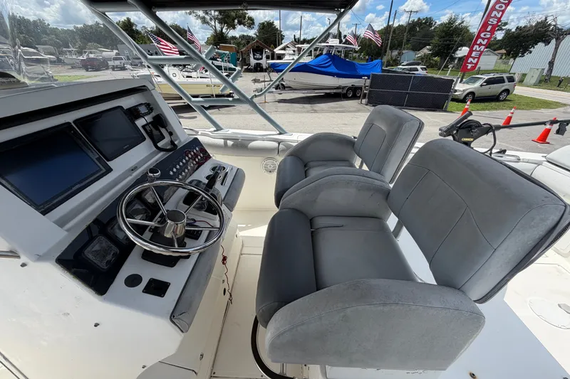 Slide: The Image of 2011 Jefferson Marlago FS35 boat cockpit with dual seats and steering wheel. - 30