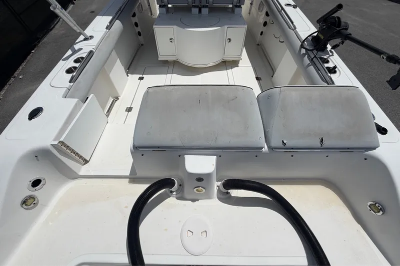 Slide: The Image of The image shows the cockpit of a 2011 Jefferson Marlago FS35 with white cushions and rod holders. - 15