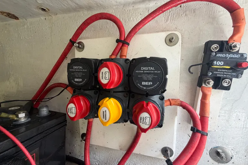 Slide: The Image of Electrical panel with switches and wiring on a 2011 Jefferson Marlago FS35 boat. - 81