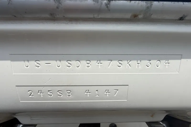Slide: The Image of 2004 Bayliner 2452 Ciera Express hull identification number and model details. - 84