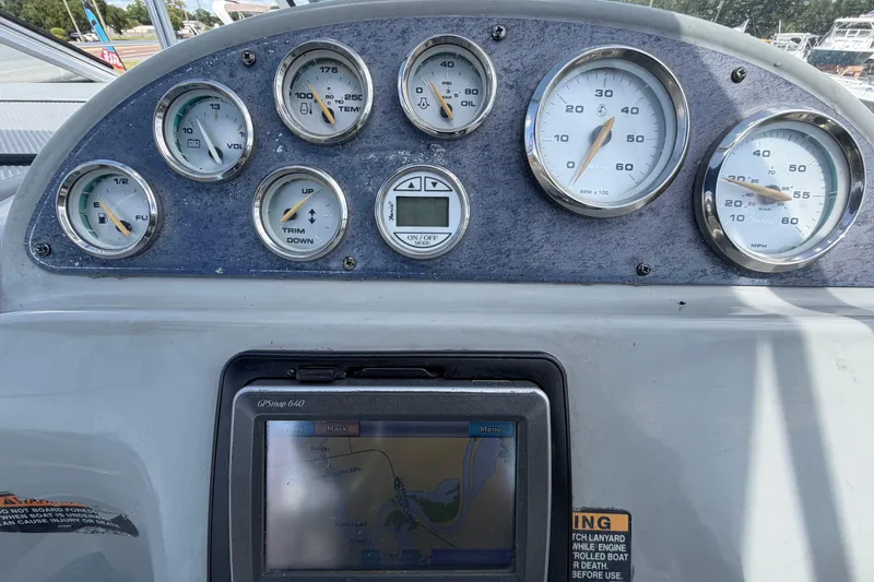 Slide: The Image of Dashboard of a 2004 Bayliner 2452 Ciera Express with gauges and GPS display. - 24
