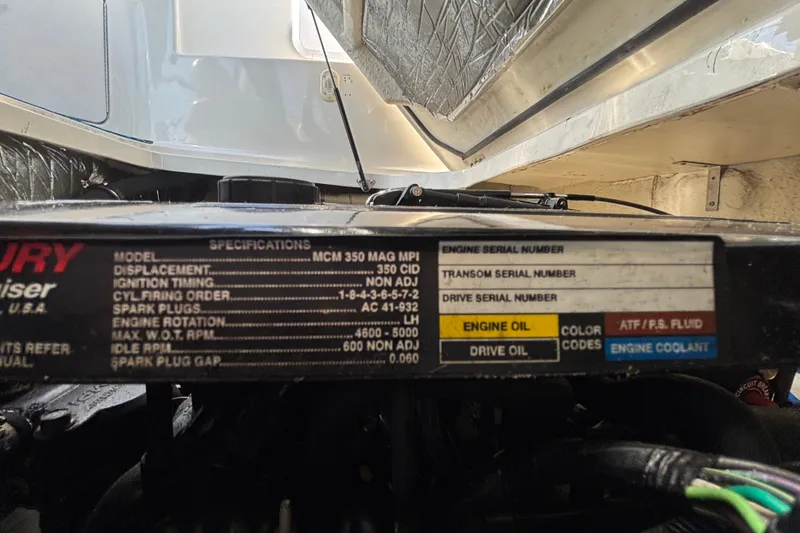 Slide: The Image of Engine specifications label on a 2004 Bayliner 2452 Ciera Express boat. - 77