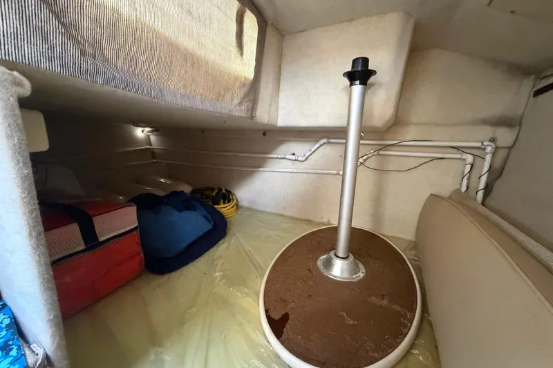 Slide: The Image of Interior cabin of 2004 Bayliner 2452 Ciera Express with storage and seating area. - 52