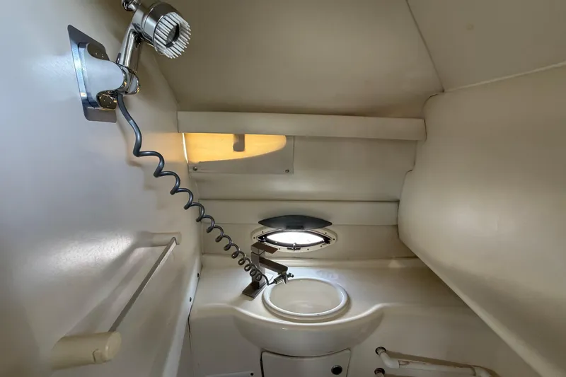 Slide: The Image of 2004 Bayliner 2452 Ciera Express boat bathroom with sink and showerhead. - 49