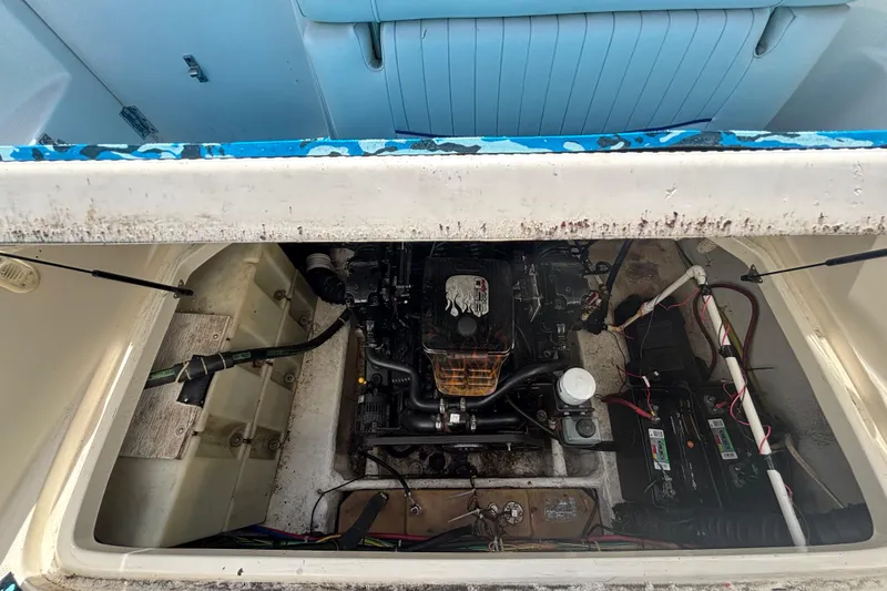 Slide: The Image of Engine compartment of a 2004 Bayliner 2452 Ciera Express boat, showing detailed components. - 75