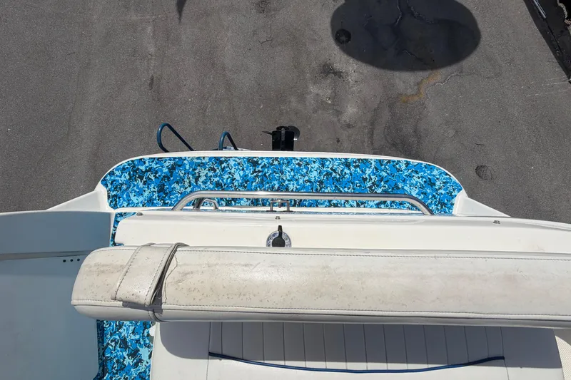 Slide: The Image of 2004 Bayliner 2452 Ciera Express boat with blue camouflage deck design. - 83