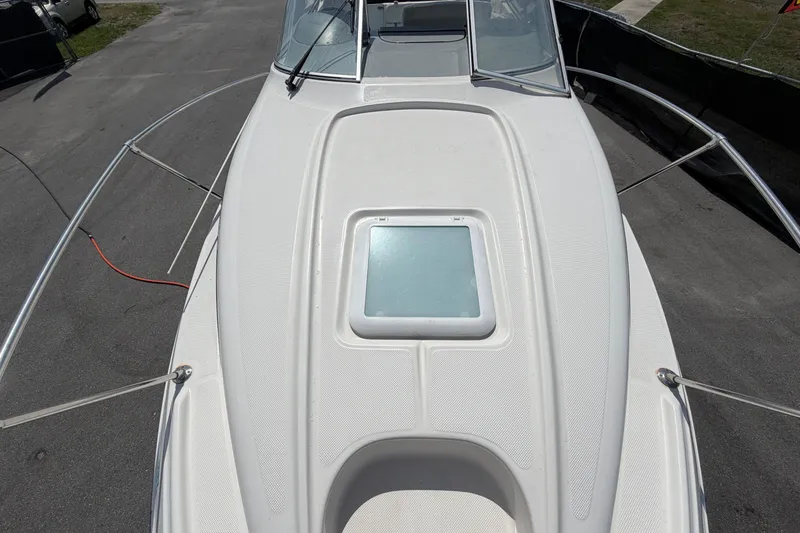 Slide: The Image of 2004 Bayliner 2452 Ciera Express boat deck with hatch, viewed from above. - 63