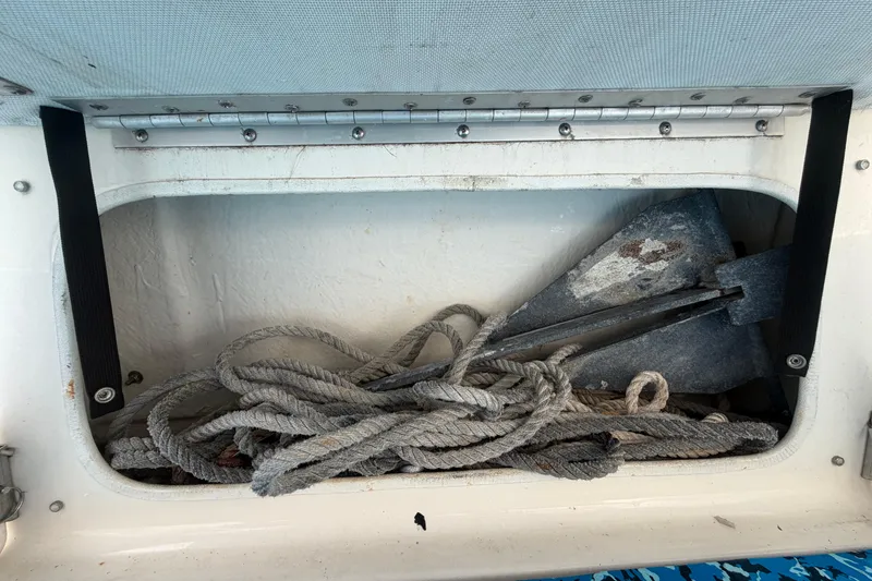 Slide: The Image of Storage compartment of 2004 Bayliner 2452 Ciera Express with anchor and rope. - 81