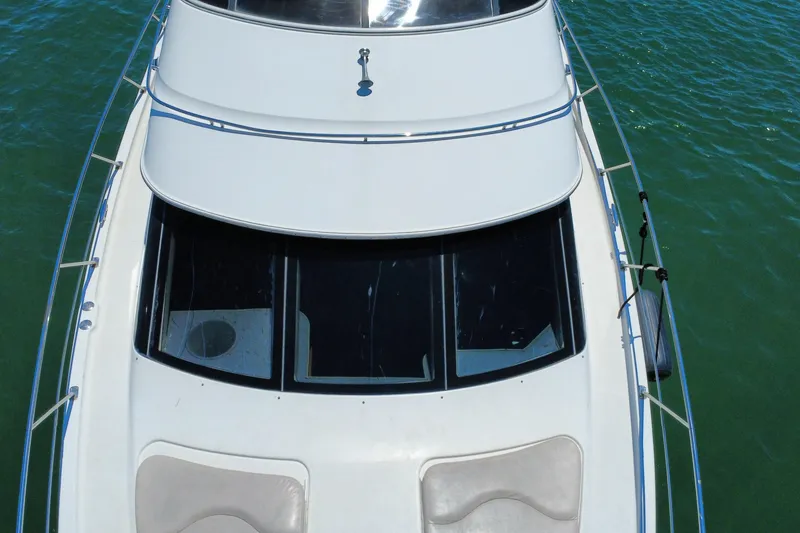Slide: The Image of Top view of 2004 Carver 444 Cockpit Motor Yacht on water. - 18