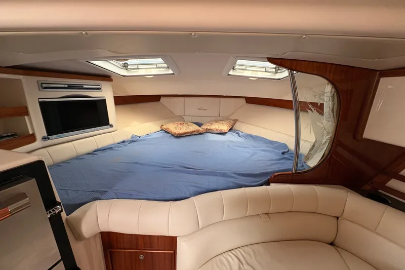 Slide: The Image of Luxurious cabin interior of 2007 Grady-White Express 360 with cozy bed and TV. - 27