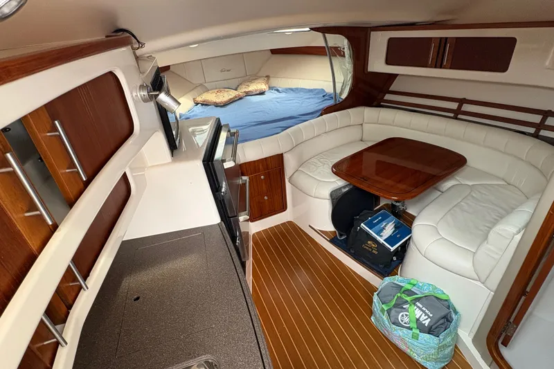 Slide: The Image of Interior of 2007 Grady-White Express 360 boat with cozy seating and wooden accents. - 22