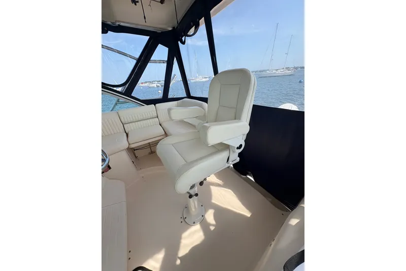 Slide: The Image of 2007 Grady-White Express 360 boat interior with white captain's chair and ocean view. - 19