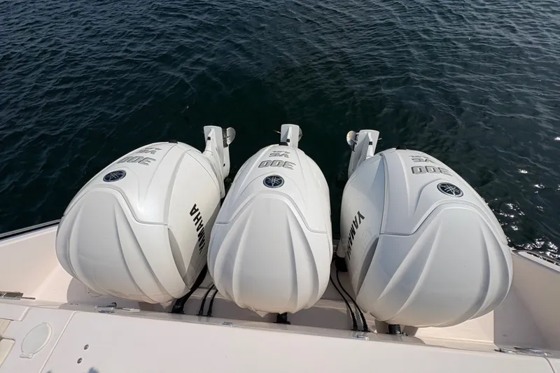Slide: The Image of Triple Yamaha 300 outboard engines on a 2007 Grady-White Express 360 boat. - 12