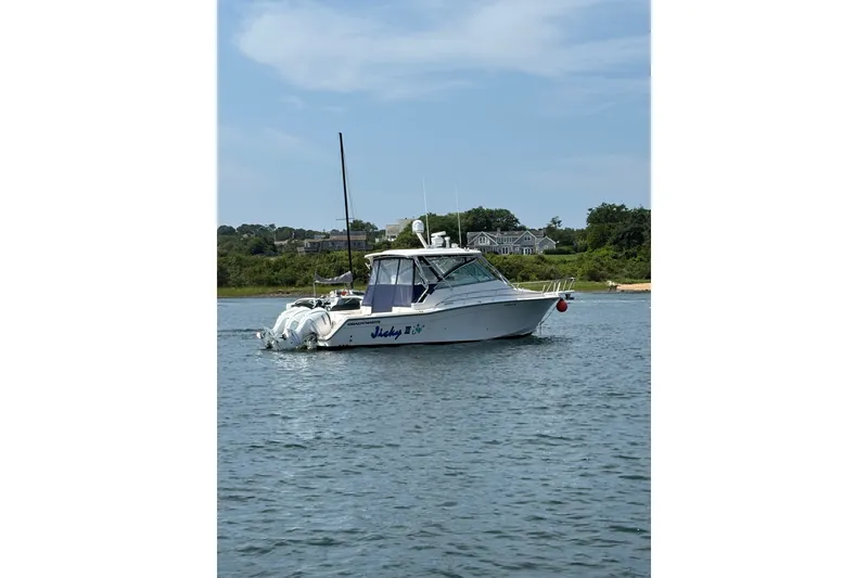 Slide: The Image of 2007 Grady-White Express 360 boat on calm water, scenic background. - 7