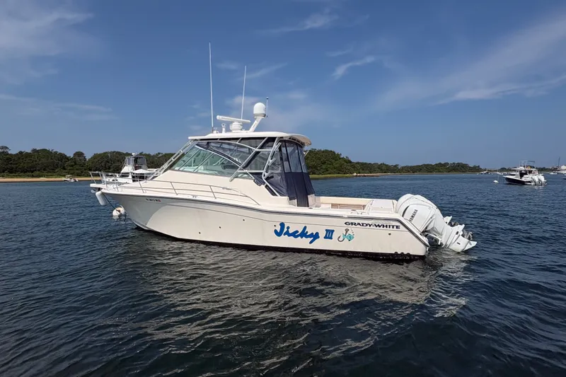 Slide: The Image of 2007 Grady-White Express 360 boat on calm water, clear sky background. - 1