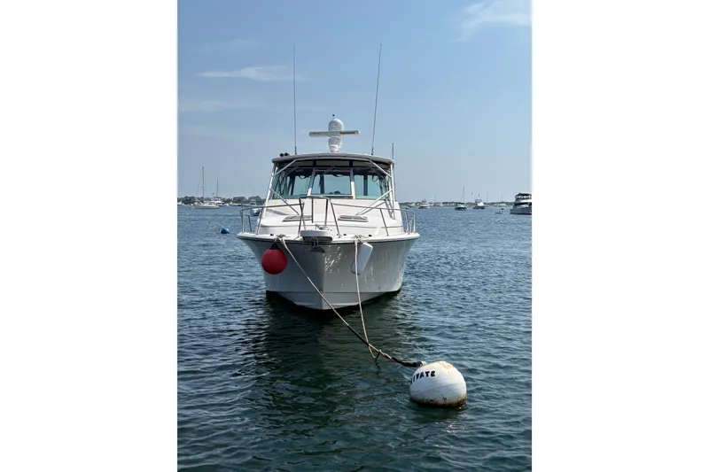 Slide: The Image of 2007 Grady-White Express 360 boat moored on calm water with buoy. - 3