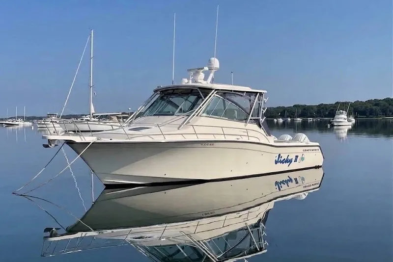 The Image of 2007 Grady-White Express 360 boat on calm water, reflecting a clear blue sky. - 0