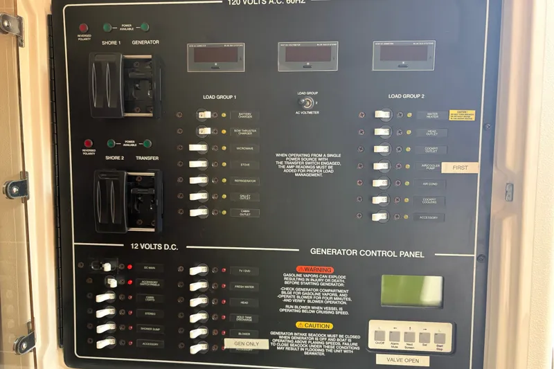 Slide: The Image of Electrical control panel on a 2007 Grady-White Express 360 boat. - 35