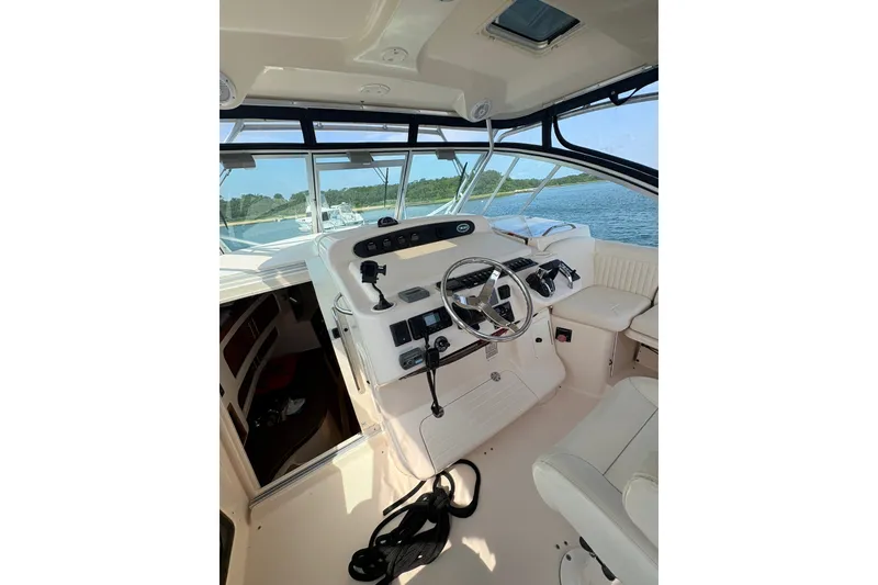 Slide: The Image of 2007 Grady-White Express 360 boat interior with steering wheel and controls. - 14