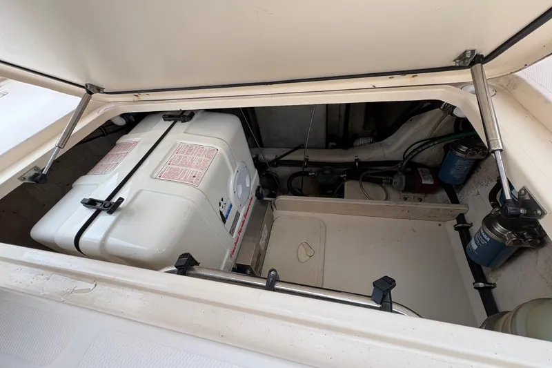 Slide: The Image of Engine compartment of a 2007 Grady-White Express 360 boat, showing equipment and storage. - 31