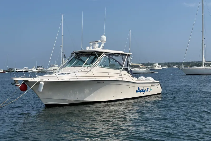 Slide: The Image of 2007 Grady-White Express 360 boat anchored in a marina with other vessels. - 2