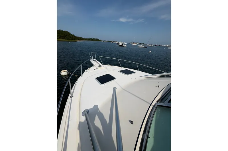 Slide: The Image of 2007 Grady-White Express 360 boat on calm water, surrounded by other vessels. - 34