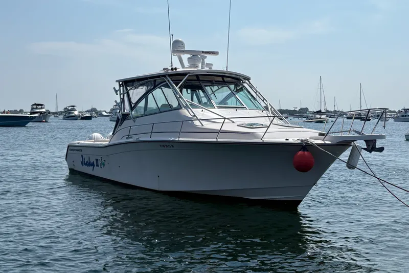 Slide: The Image of 2007 Grady-White Express 360 boat anchored in a marina with other vessels. - 5