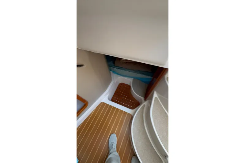 Slide: The Image of Interior view of 2007 Grady-White Express 360 boat cabin with wooden flooring. - 21
