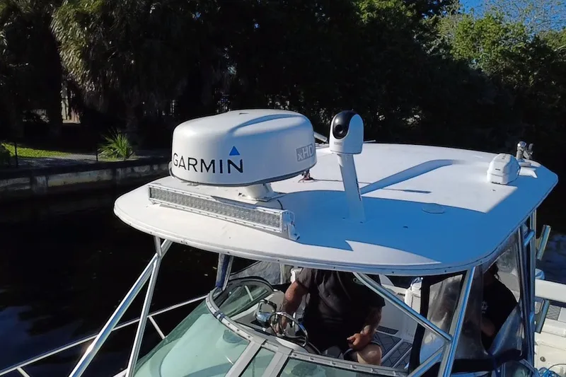 Slide: The Image of 2004 Century 3200 Walk-Around boat with Garmin radar on top. - 13