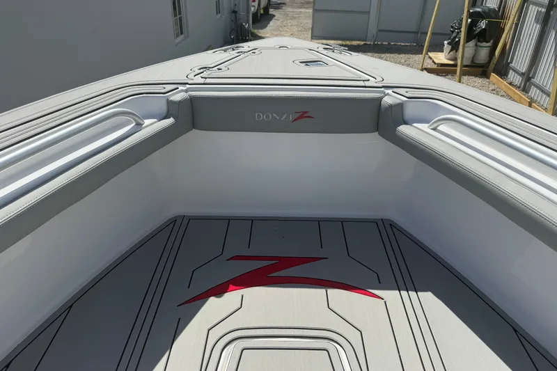 Slide: The Image of 2004 Donzi 29 ZF Open boat interior with sleek design and logo detailing. - 39