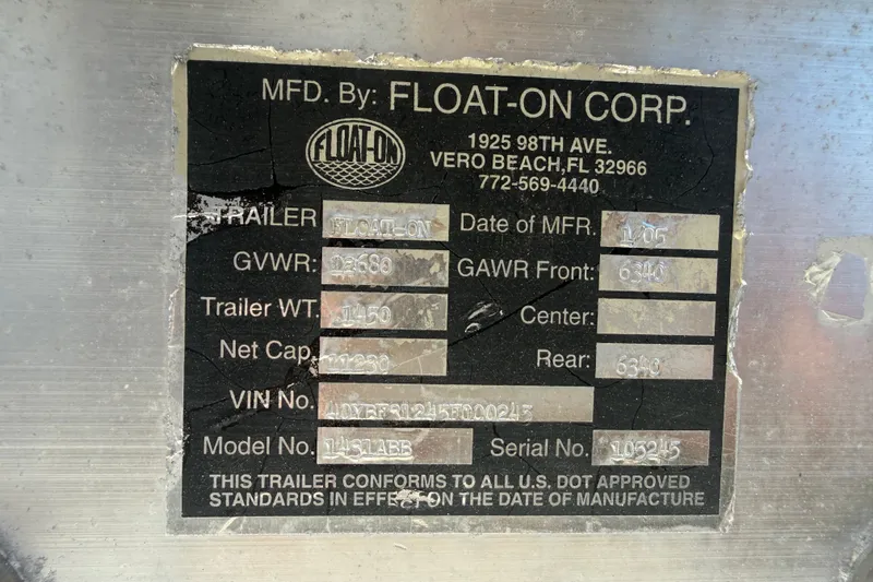 Slide: The Image of Label on a Float-On Corp trailer, detailing specifications and compliance information. - 63