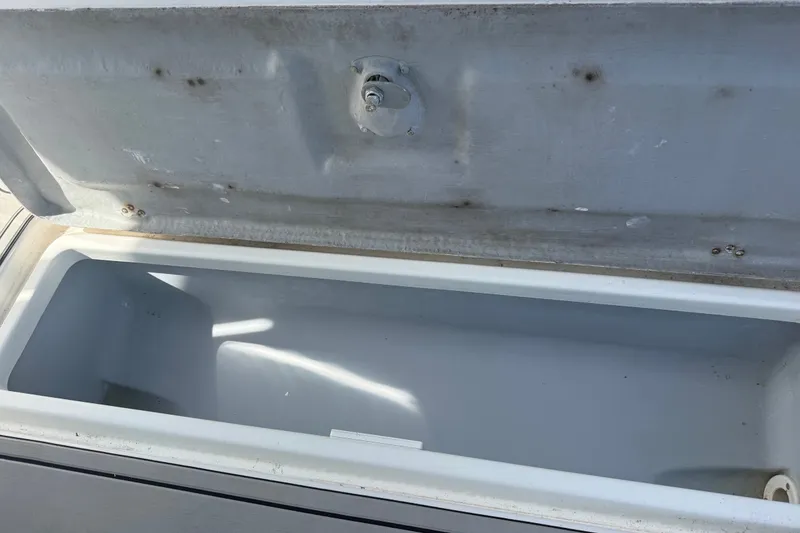 Slide: The Image of Open storage compartment on a 2004 Donzi 29 ZF Open boat. - 46