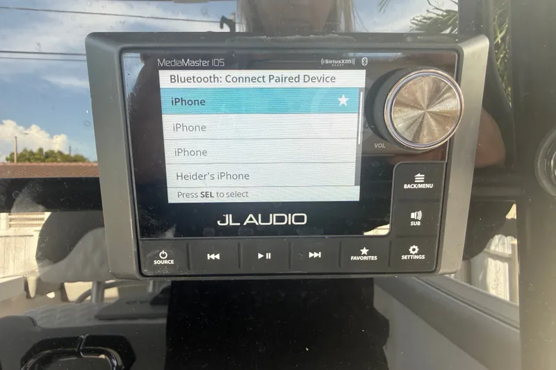 Slide: The Image of JL Audio MediaMaster 105 displaying Bluetooth device options on a 2004 Donzi 29 ZF Open boat. - 31