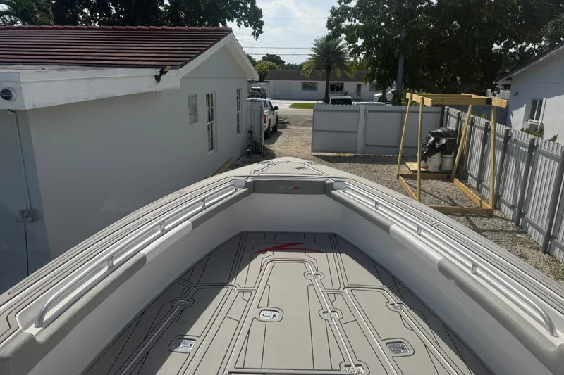 Slide: The Image of 2004 Donzi 29 ZF Open boat deck, parked in a residential driveway. - 38