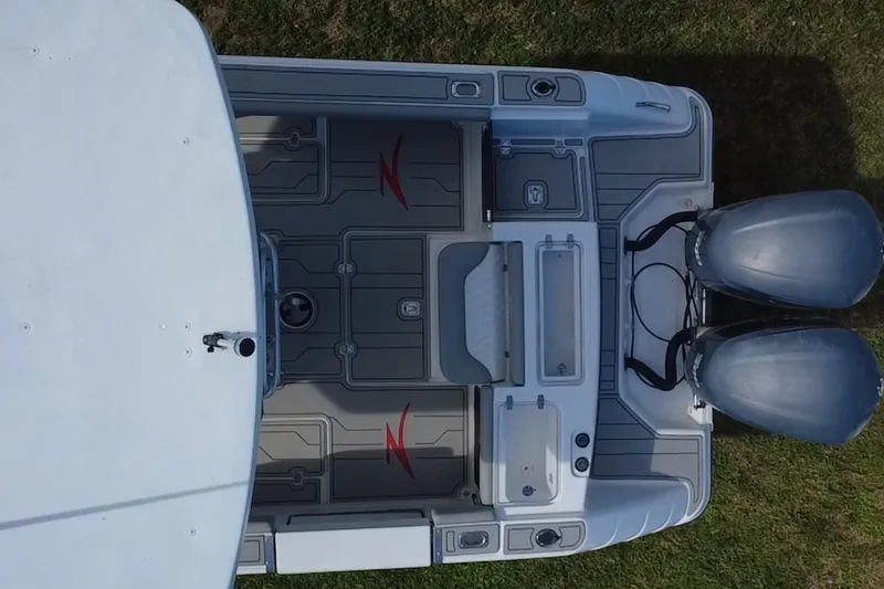 Slide: The Image of Aerial view of 2004 Donzi 29 ZF Open boat with twin engines on grass. - 20