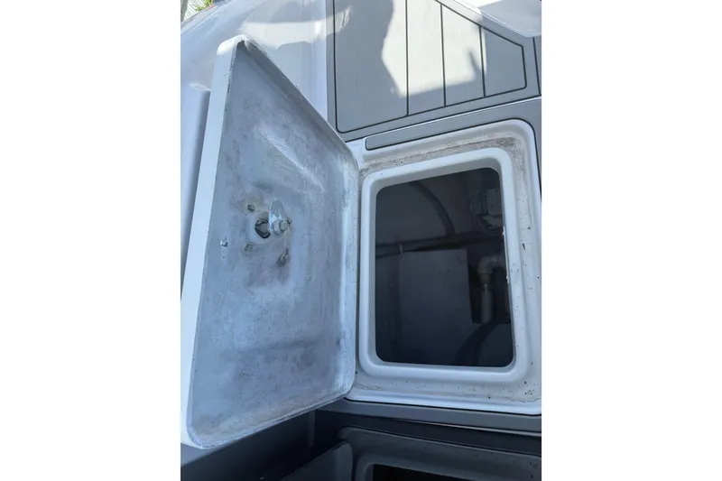 Slide: The Image of Open storage compartment on a 2004 Donzi 29 ZF Open boat. - 45