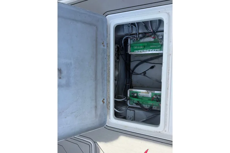 Slide: The Image of Battery compartment of a 2004 Donzi 29 ZF Open boat, featuring Interstate batteries. - 56