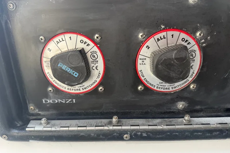 Slide: The Image of Close-up of dual battery switches on a 2004 Donzi 29 ZF Open boat. - 34
