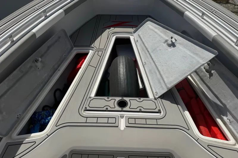 Slide: The Image of Open storage compartments on a 2004 Donzi 29 ZF Open boat deck. - 44