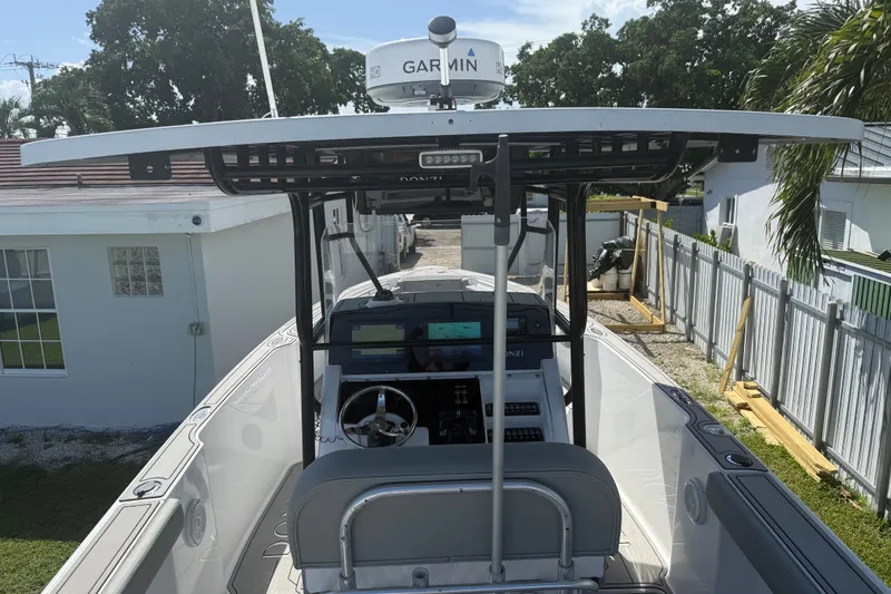 Slide: The Image of 2004 Donzi 29 ZF Open boat with Garmin radar, docked near residential area. - 23