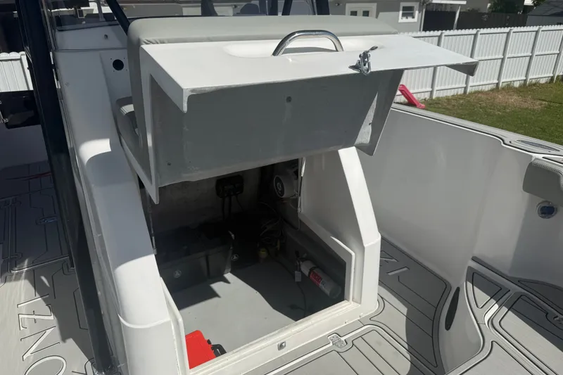 Slide: The Image of 2004 Donzi 29 ZF Open boat interior with open storage compartment. - 50