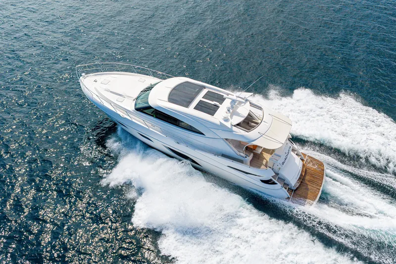 Slide: The Image of 2019 Riviera 6000 Sport Yacht cruising on open water - 16